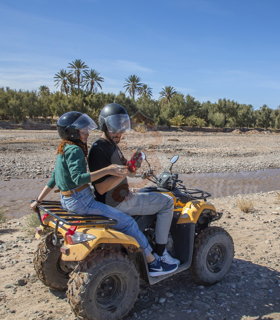 Quad biking adventure through Skoura palm grove near Bassatine Skoura hotel, Morocco